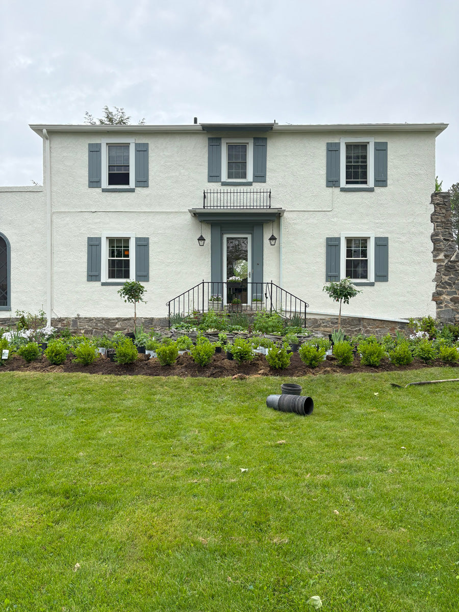 Before and after cottage garden transformation in front of white house