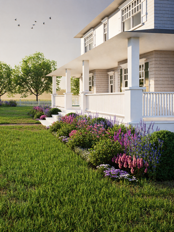 White house with a porch and garden featuring purple flowers and green grass.